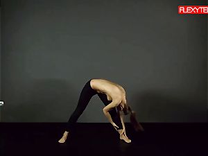dark-haired gymnast showing of her bootie